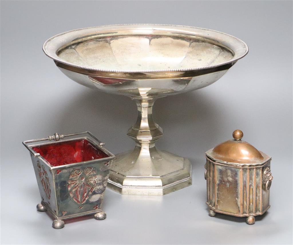 A large silver plated comport, after Christopher Dresser, diameter 33cm, a plated sugar basket with red glass liner and a Victorian pla